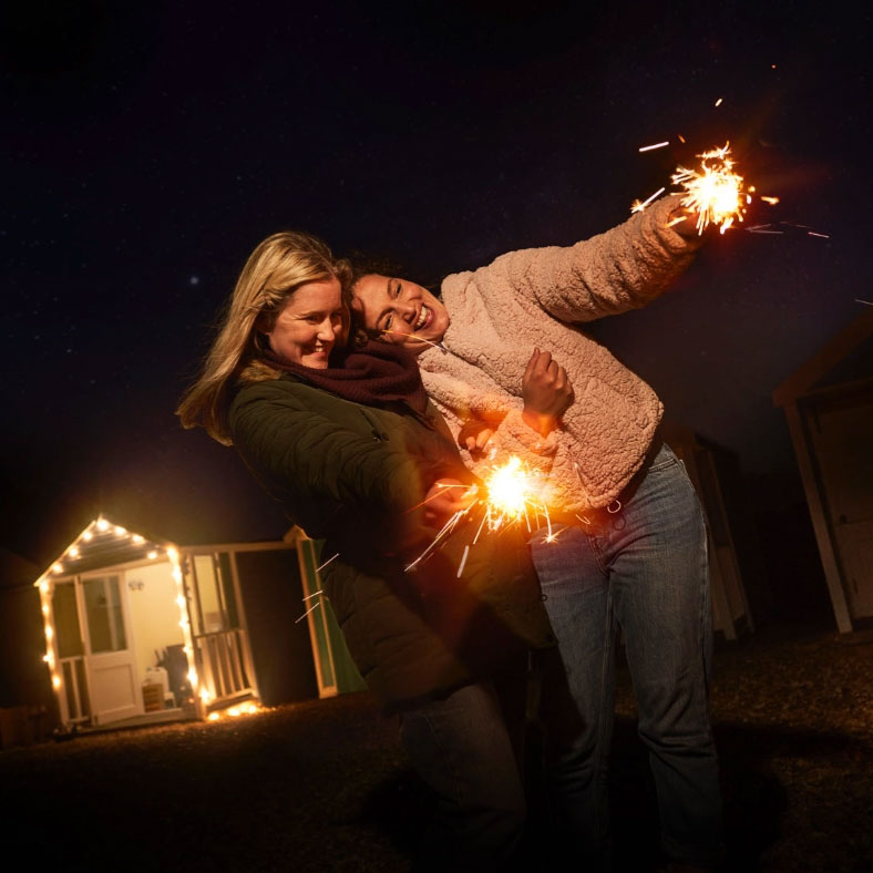 Two people with sparklers